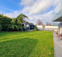 Garden space of a family house on Jánošíkova Street in Piešťany with a terrace and garden seating.
