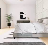 A bedroom in a family house with a comfortable bed, a plant, and large windows.