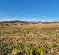 Plots - living in Velčice with a view of the hills and village buildings.