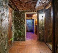 Stone walls and a brick ceiling create a rustic atmosphere in the building's interior.