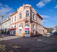 A historic building in Poprad with decorative architectural elements on the corner of the street.