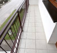 A balcony in a family house on Dolný Lopašov Street in Dolný Lopašov with tiles and a railing.