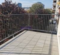 The balcony of a 2-room apartment on Drieňová Street in Bratislava - Ružinov with greenery in the background.