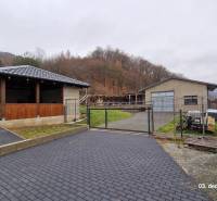 The exterior of a family house on Kopaninova Street in Sokol with a gazebo and a gate.