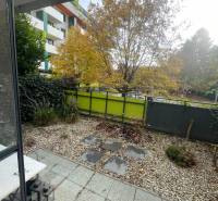 In Trnava, exterior of a 2-room apartment with a terrace, garden, and modern architecture.