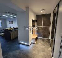 In the 2-room apartment, there are wardrobes, a dining table, and a kitchen unit.