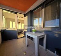 Balcony of a 2-room apartment in Trnava with a view and a table on the terrace.