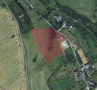 Aerial map of agricultural and forest lands around Banská Štiavnica.