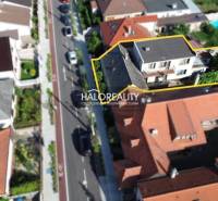 Aerial view of a family house in Malacky with surrounding gardens.