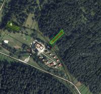 Aerial view of agricultural and forest land in Rajecká Lesná with marked parcels.