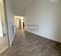 Interior of a family house with a wooden decor floor and white walls.