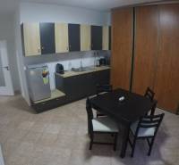 Offices with a kitchenette and dining table, floor with ceramic tiles.