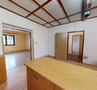Interior of a family house with wooden floor decor and light-colored walls.