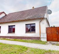 A family house on SNP Street in Veľké Leváre, with a white facade and a gabled roof.