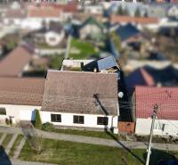 A family house on SNP Street in Veľké Leváre with a front garden and a sloped roof.