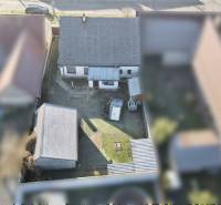 A top-down view of a family house with a yard on SNP Street in Veľké Leváre.