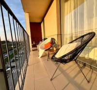 The balcony of a 1-room apartment on Žltá Street in Petržalka with a view of the surroundings of Bratislava.
