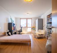 Children's room with a bed, desk, chair, and shelf in a 3-room apartment.