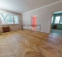 The interior of a 3-room apartment with a wooden decor floor and light-colored walls.