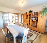 Interior of a 3-room apartment with wooden furniture and flooring with a wooden decor.