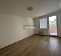 A spacious room with a large window and balcony doors in a 3-room apartment.