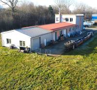 Production premises on Továrenská Street in Dubnica nad Váhom surrounded by greenery.