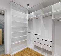 Wardrobe with shelves, drawers, and a toilet, floor with wooden decor, family house.