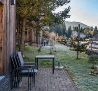 Wooden cladding of the Holiday Apartment on Do doliny Street, Liptovský Mikuláš with a view of nature.