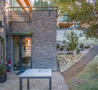 Exterior of a holiday apartment on Do doliny street in Liptovský Mikuláš with stone details.