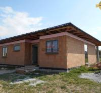 A family house in Nové Mesto nad Váhom under construction, surrounded by a grassy plot.