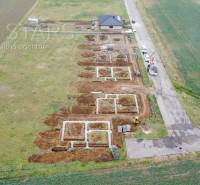 Construction of a family house on the street in Štvrtok, view of the building foundations and surroundings.