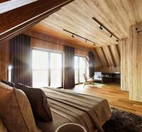 A room with large windows, wooden walls, and a floor with a wooden decor. House construction.