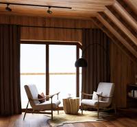 Interior with two chairs, a lamp, and a wooden-patterned floor. House construction.