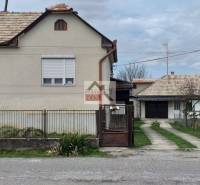 Family house in Studená with a front garden, garage, and a lawn. The house is for sale.