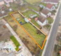 A residential plot in Jahodná with a garden and access to the road.