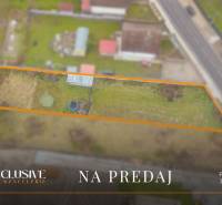 Offered residential land in Jahodná near the road with a grassy area.