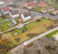 Plots - living in Jahodná: fenced plot with lawn and garden equipment.