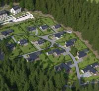 Development plots in Tajov with modern houses surrounded by nature and forest.