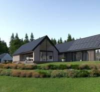 Development plots in Tajov with modern houses surrounded by greenery and forests.