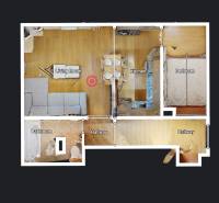 Floor plan of a 2-room apartment with wood-patterned flooring and furnishings.