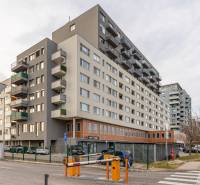 Apartment building on Budatínska Street in Bratislava - Petržalka, with parking and shops.