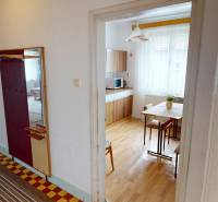 Interior of a family house with a hallway, kitchen, and floor with a wooden decor.