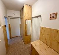 Interior of a 3-room apartment with built-in wardrobes and flooring with a wood decor.