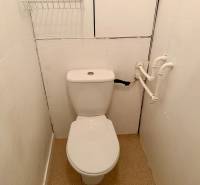 Bathroom in a 3-room apartment with a toilet and white walls.