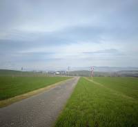 A path in nature surrounded by meadows in Spišské Tomášovce, ideal for a family house.