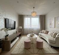 Living room in a 3-room apartment with a comfortable sofa and a television.