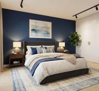 A bedroom in a 3-room apartment with a blue wall, white cabinets, a plant, and a floor with a wood decor.