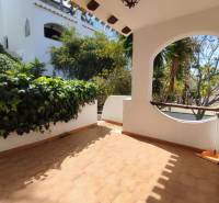 Terrace of a family house in Orihuela Costa, Villa Martin with paving and greenery.
