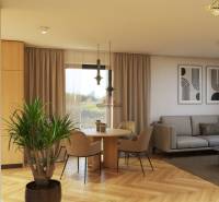 Living room in a family house with a sofa, a plant, and a wooden decor floor.