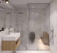 A bathroom with white marble walls, a sink, and a glass shower in a vacation apartment.